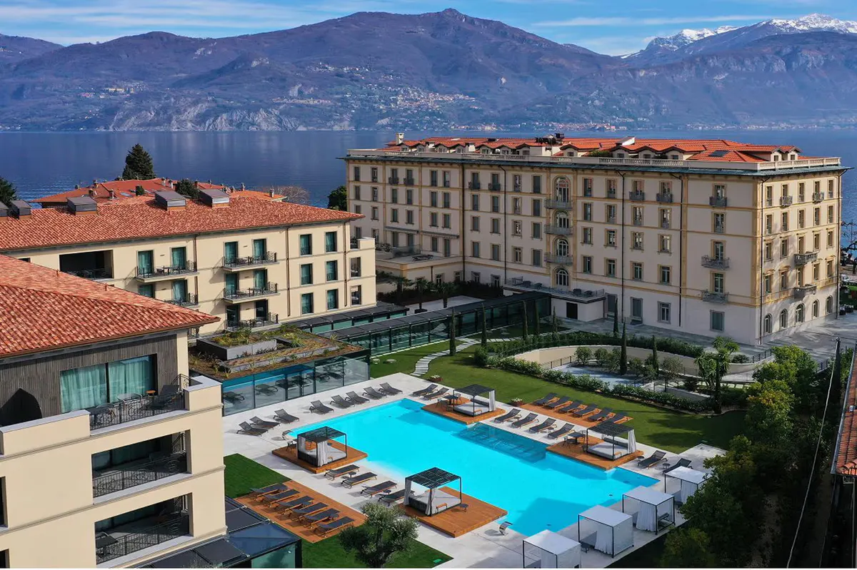 The hotel and pool area viewed from above with surrounding landscape