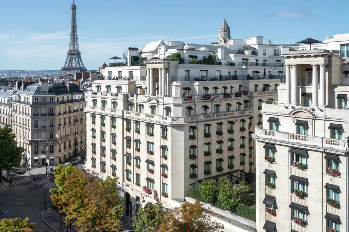 A Parisian cityscape with the Eiffel Tower visible and stone buildings below
