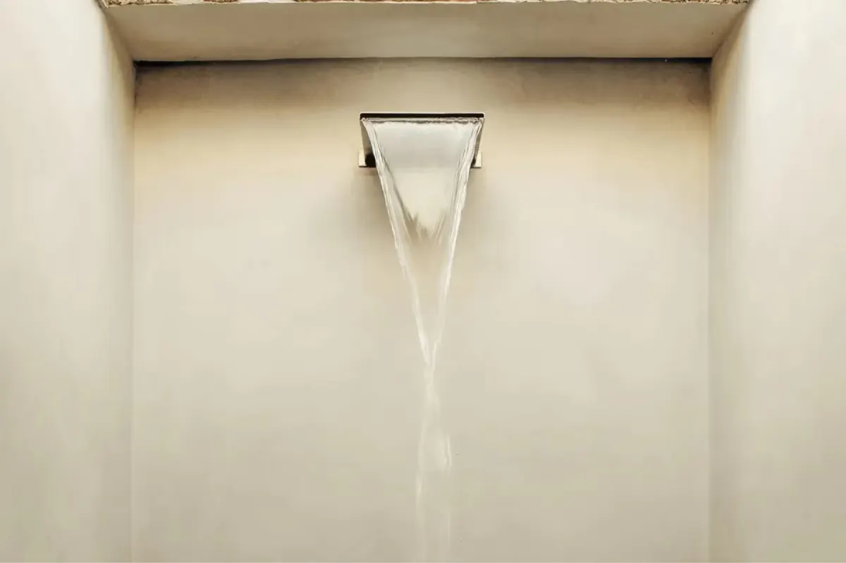 Minimalist interior view of architectural window frame casting clean shadow on plaster wall