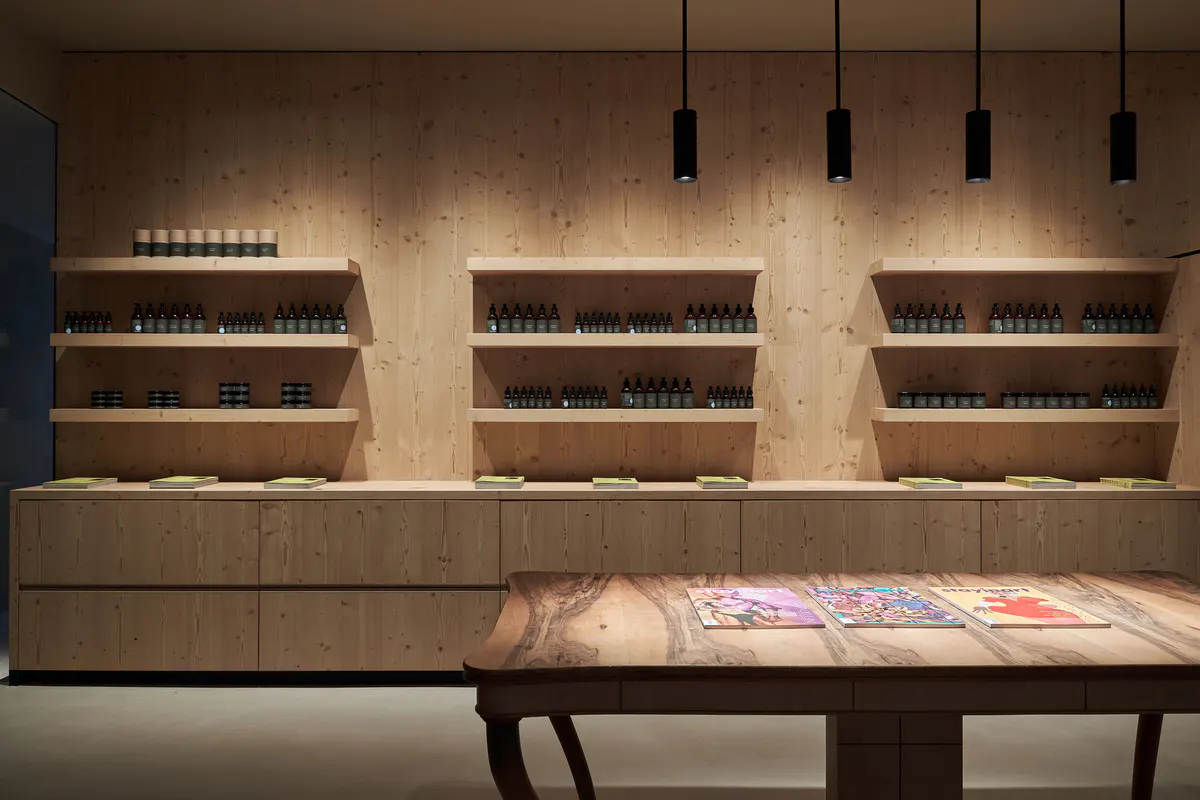 A quiet rest room with soft lighting, natural wood finishes, and minimal furnishings for relaxation