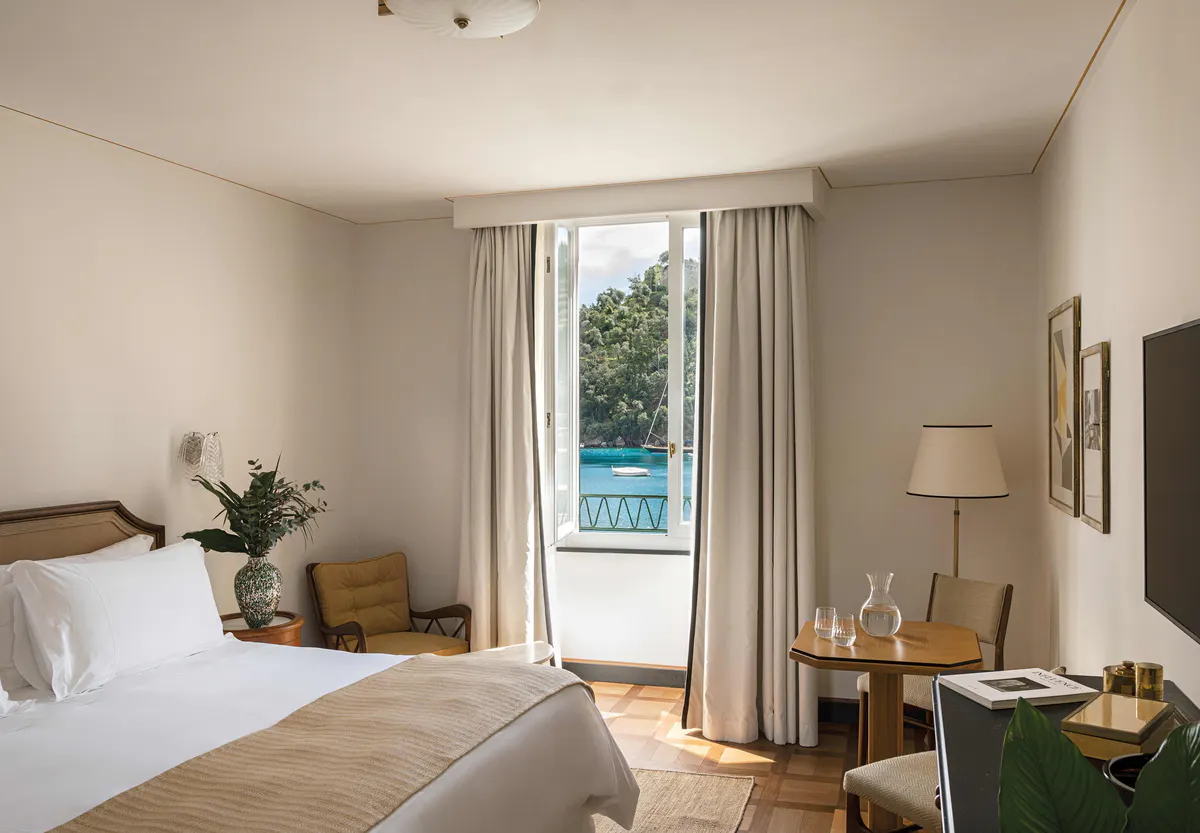 Bright guest room with sea-view balcony and window seat