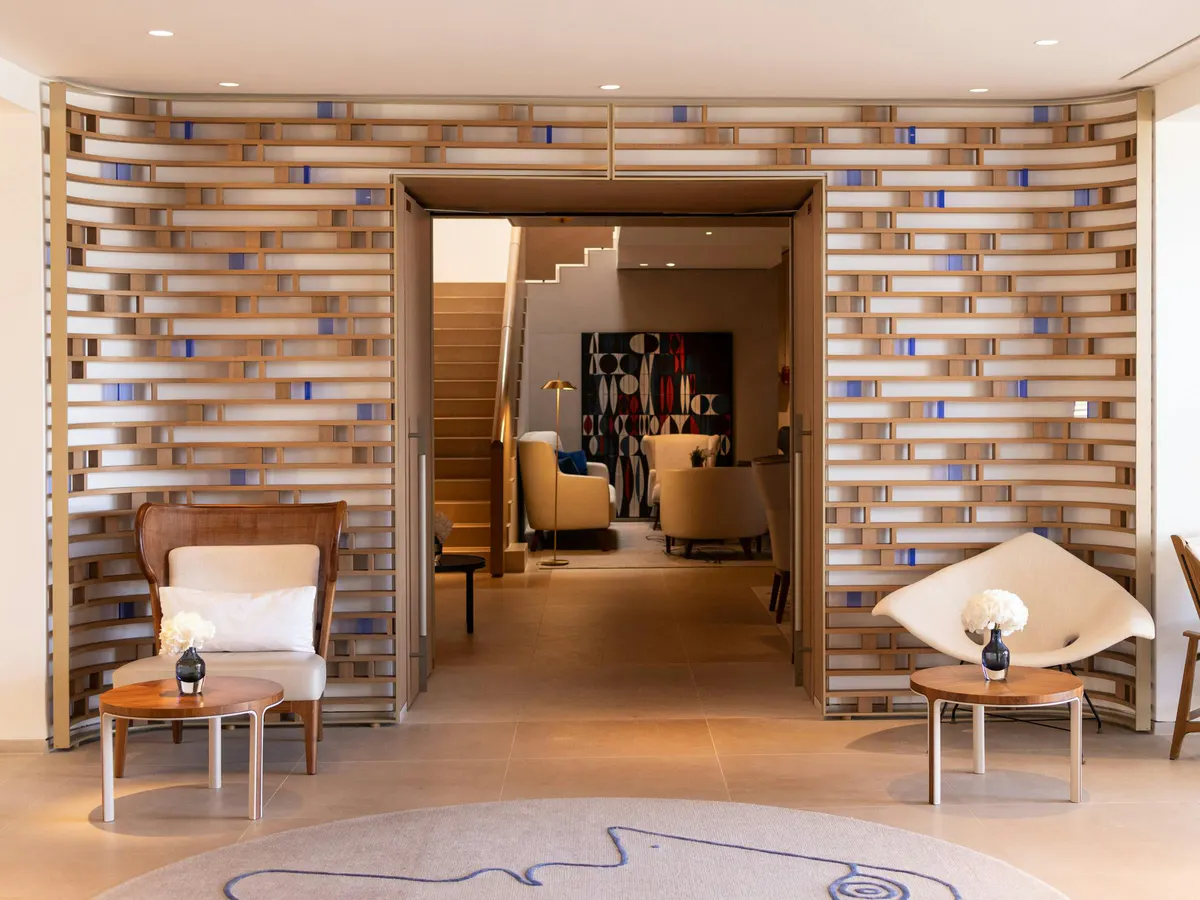 Bar lounge with brick feature wall and warm ambient lighting