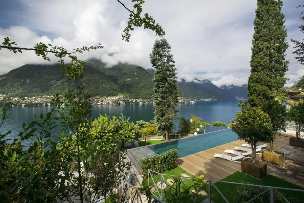 Terraced infinity pool with lake and mountains beyond