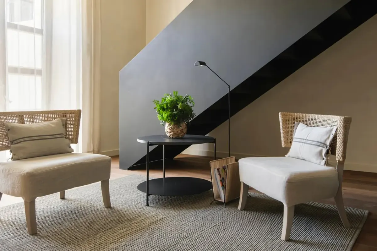 Suite interior with warm lighting and curated furnishings