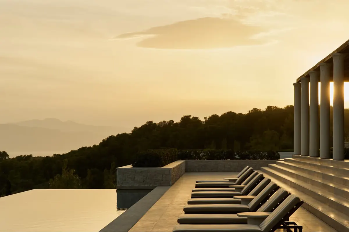 Resort complex with pool reflecting contemporary architecture
