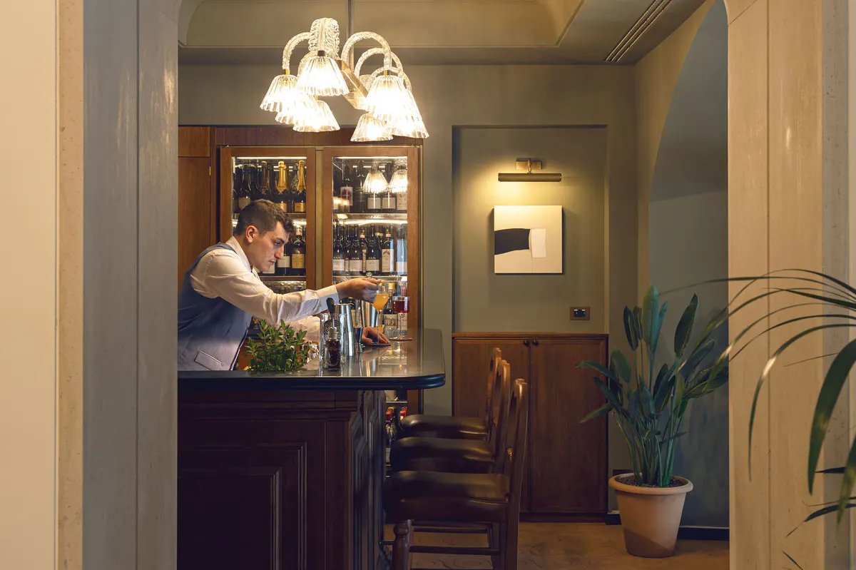 Bar area viewed from hall with bar shelving