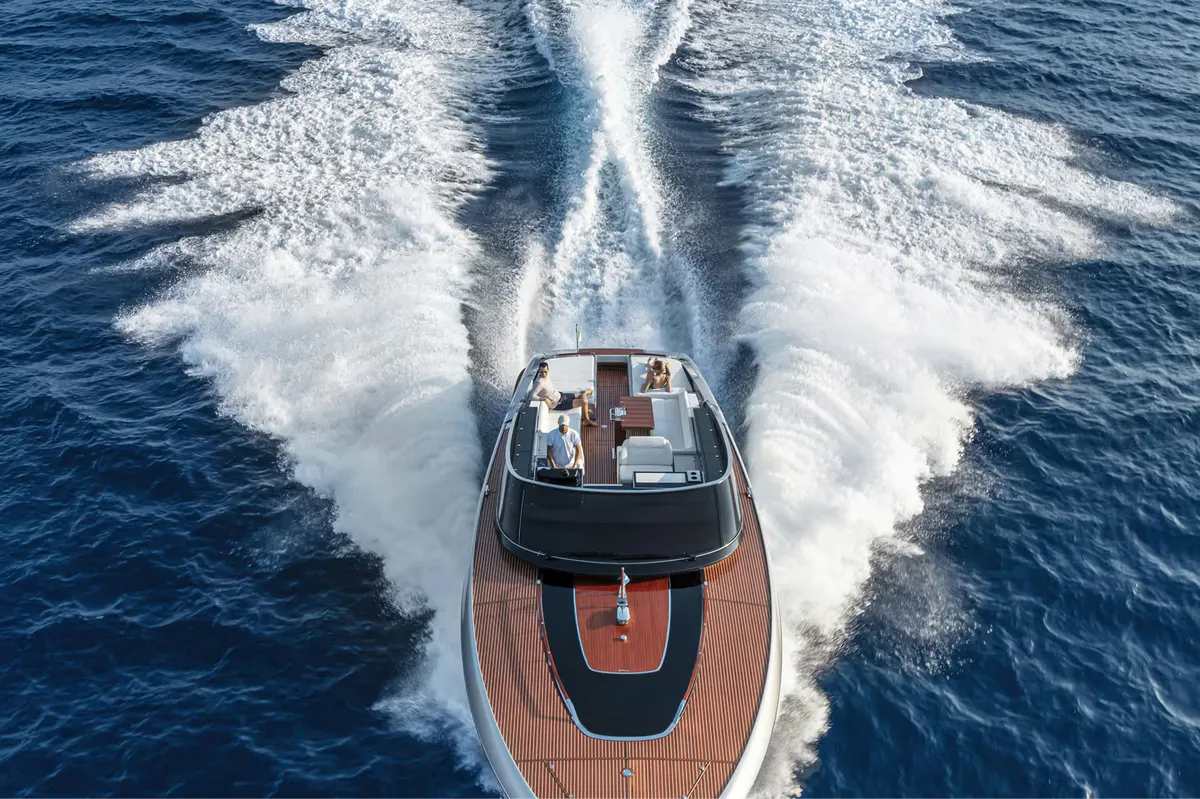 Speedboat with wake across blue Mediterranean