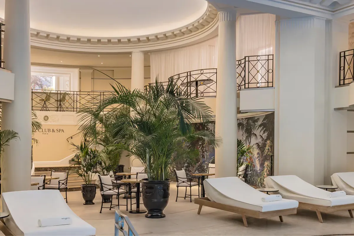 The spa area with domed ceiling, potted plants, loungers, and classical architectural detailing