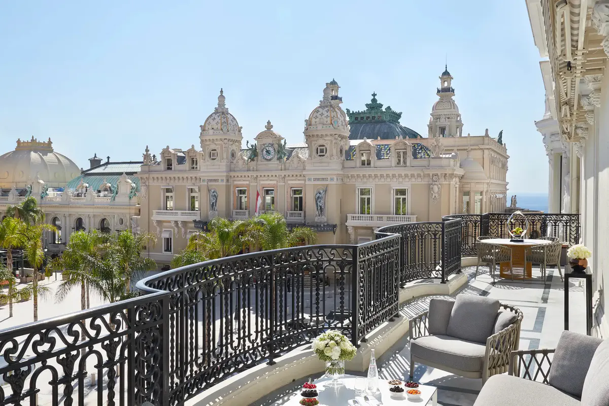 Balcony view of palazzo domes and Mediterranean beyond iron railing