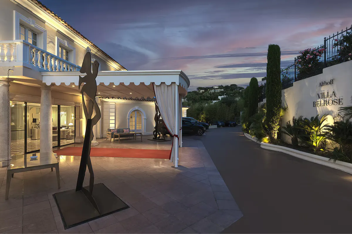 Illuminated terraced exterior at dusk with spa facilities and sea views