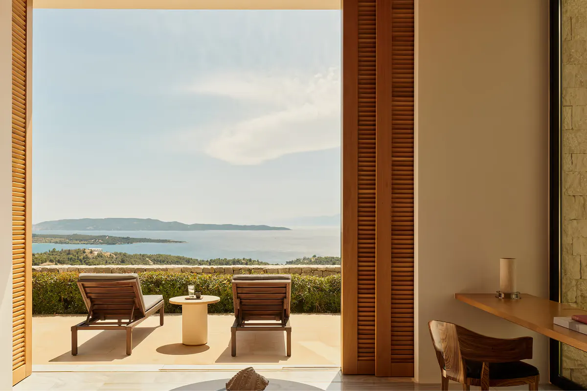 Contemporary architecture with columned pergola overlooking calm bay waters