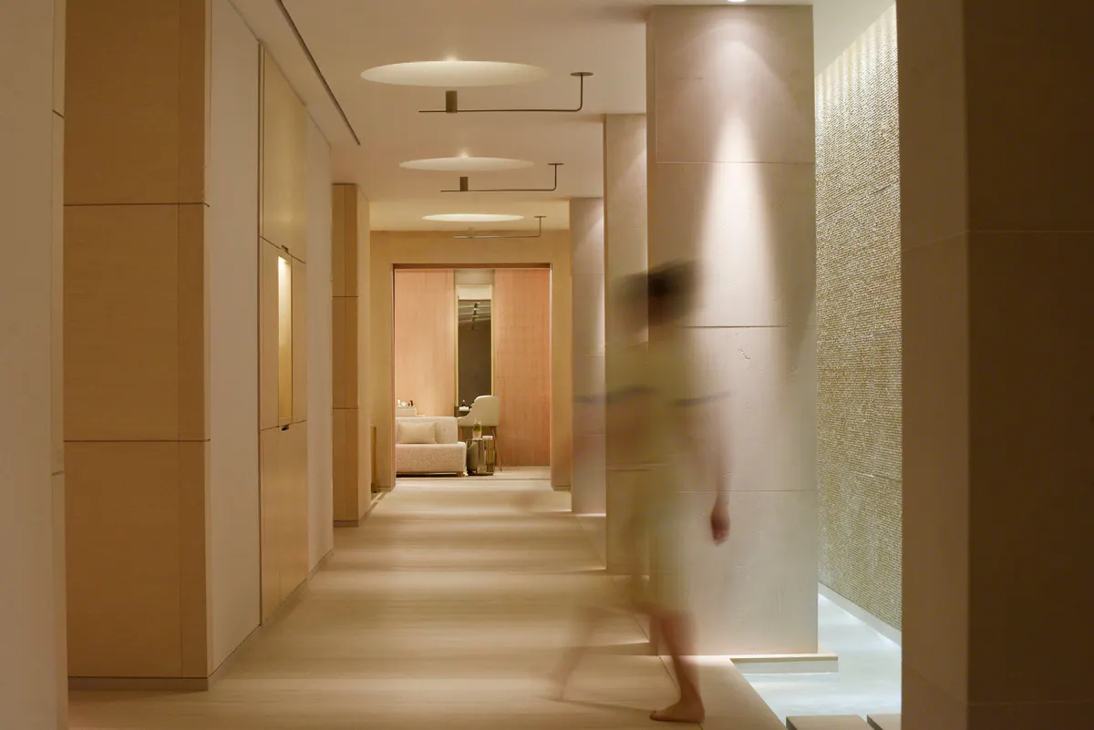 Spa corridor with taupe walls and subtle lighting