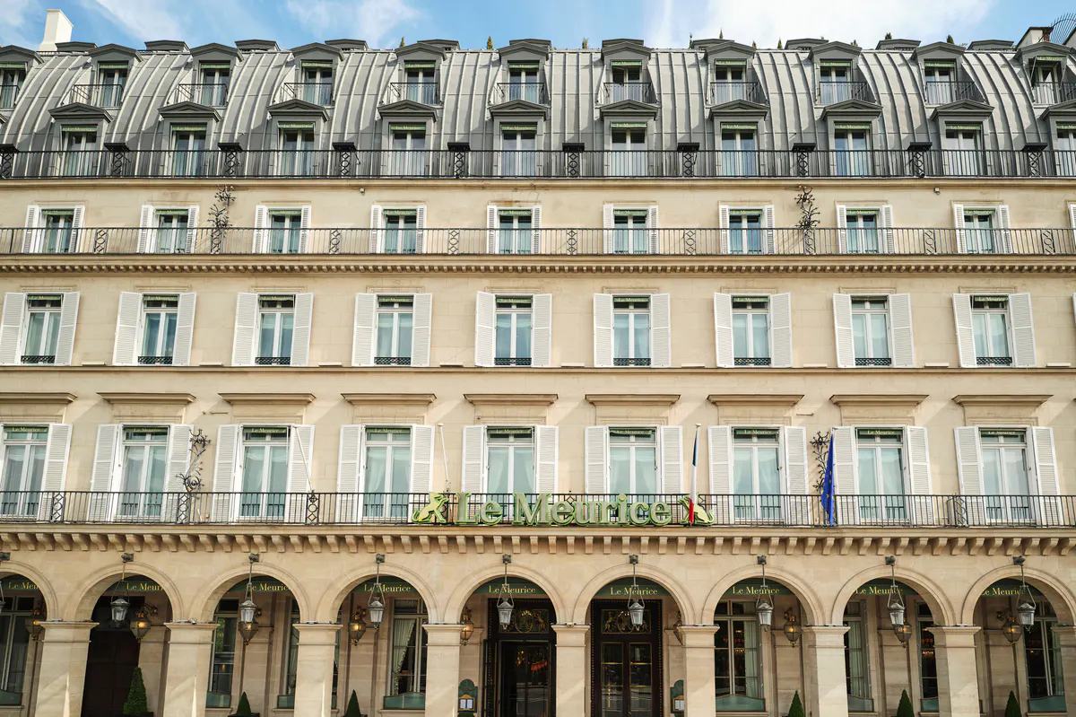The historic Beaux-Arts facade of the hotel, a cream-colored palazzo with mansard roof