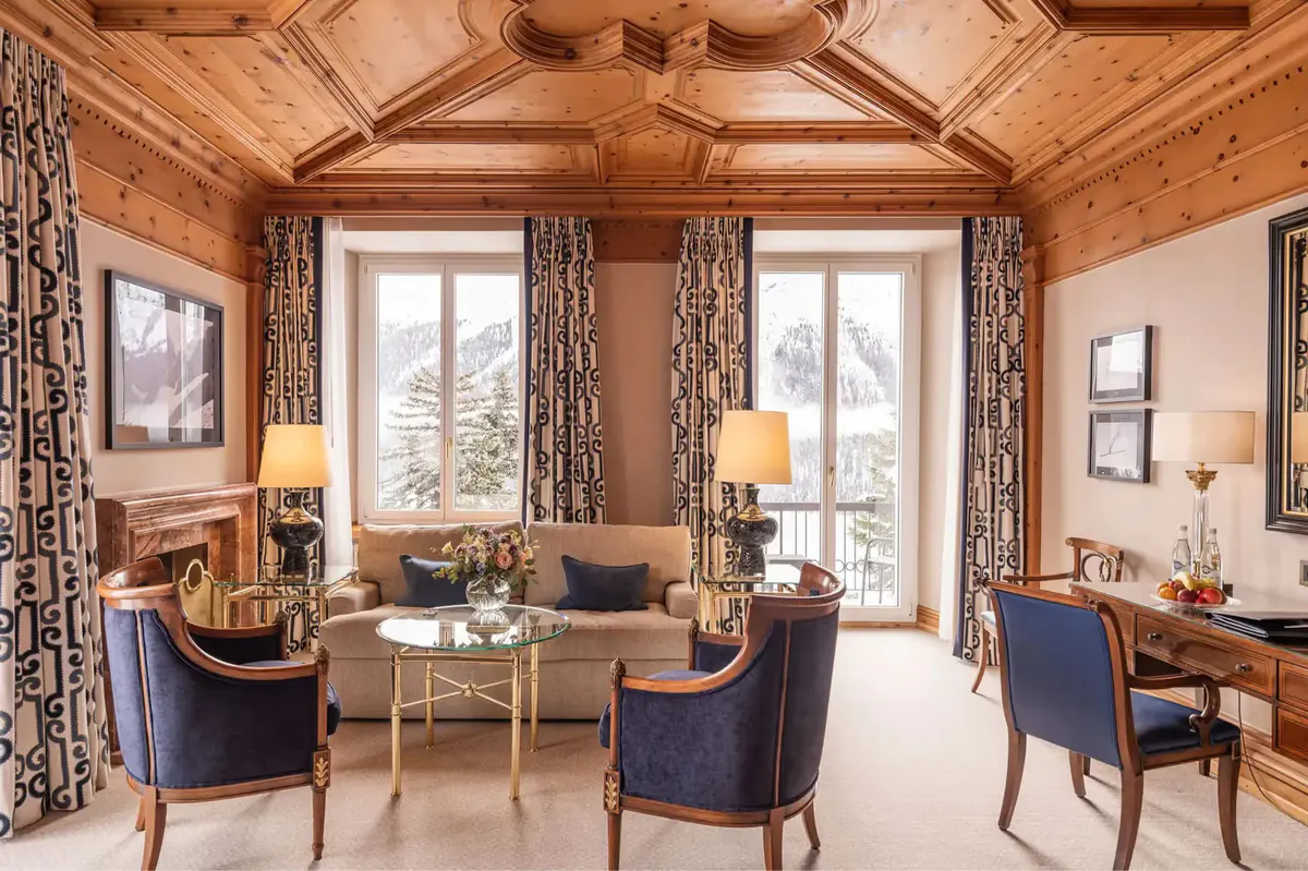 A living room with wood architecture, fireplace, and contemporary furnishings