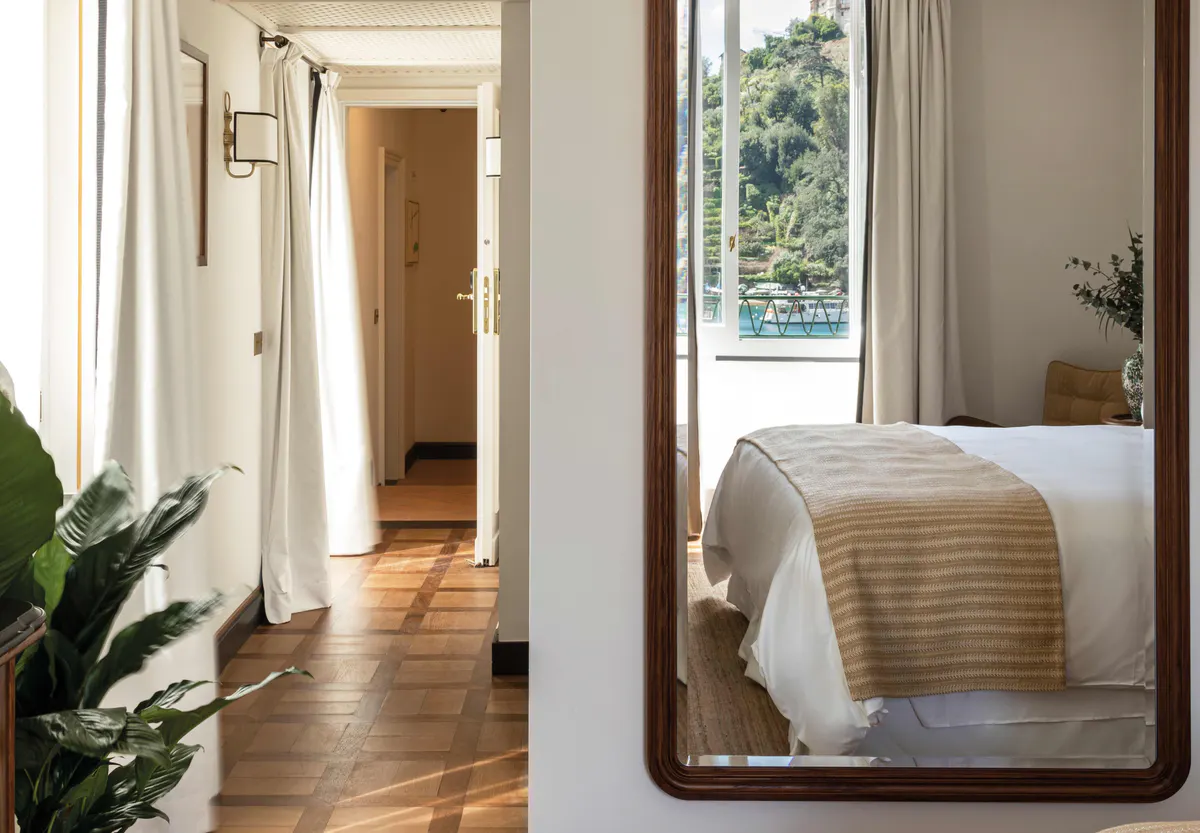 Hallway leading to guest room with modern wooden door