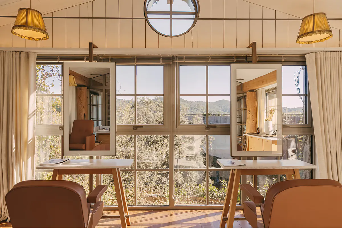 Wellness studio with pendant lights and large windows