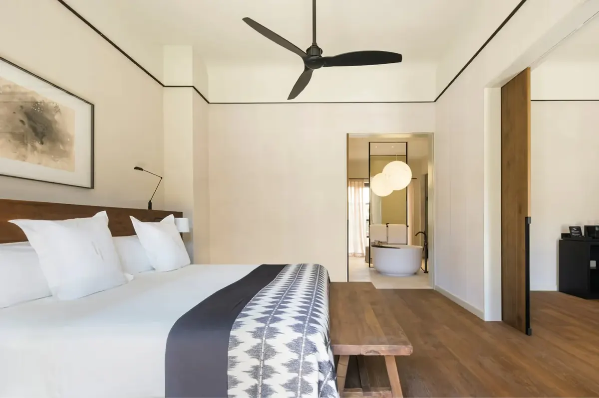 Guest room with contemporary design and neutral furnishings