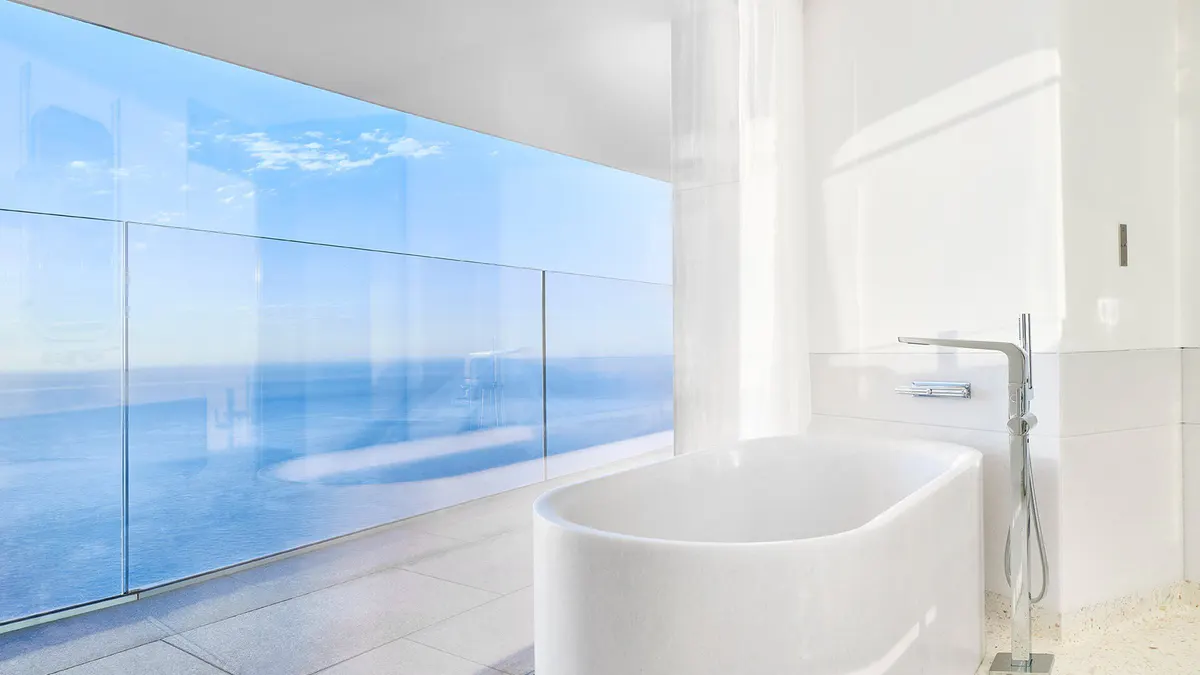 Bathroom with freestanding tub and sea views