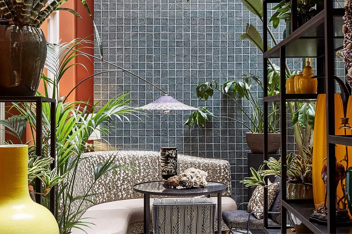 Courtyard terrace with potted plants, natural light, and intimate seating