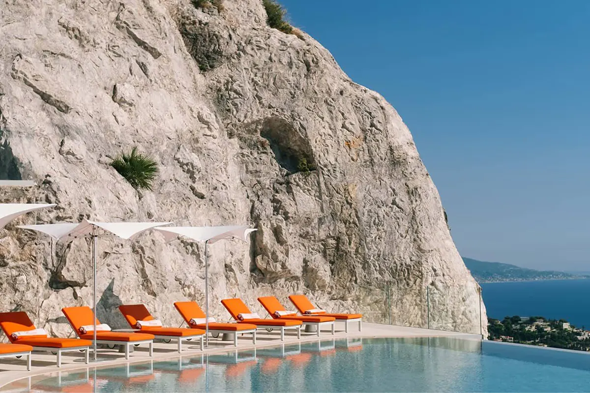 Infinity pool at cliff edge overlooking Mediterranean
