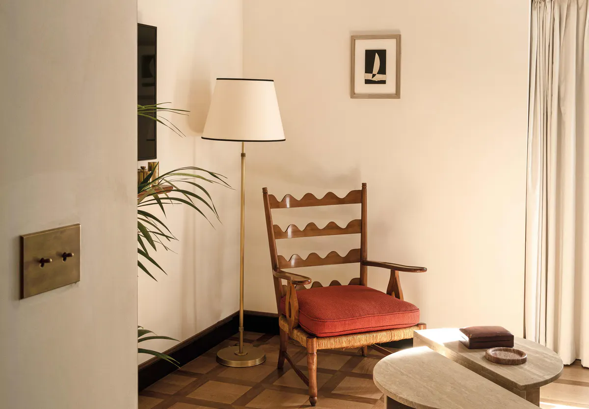 Room corner with ladder-back chair and lamp