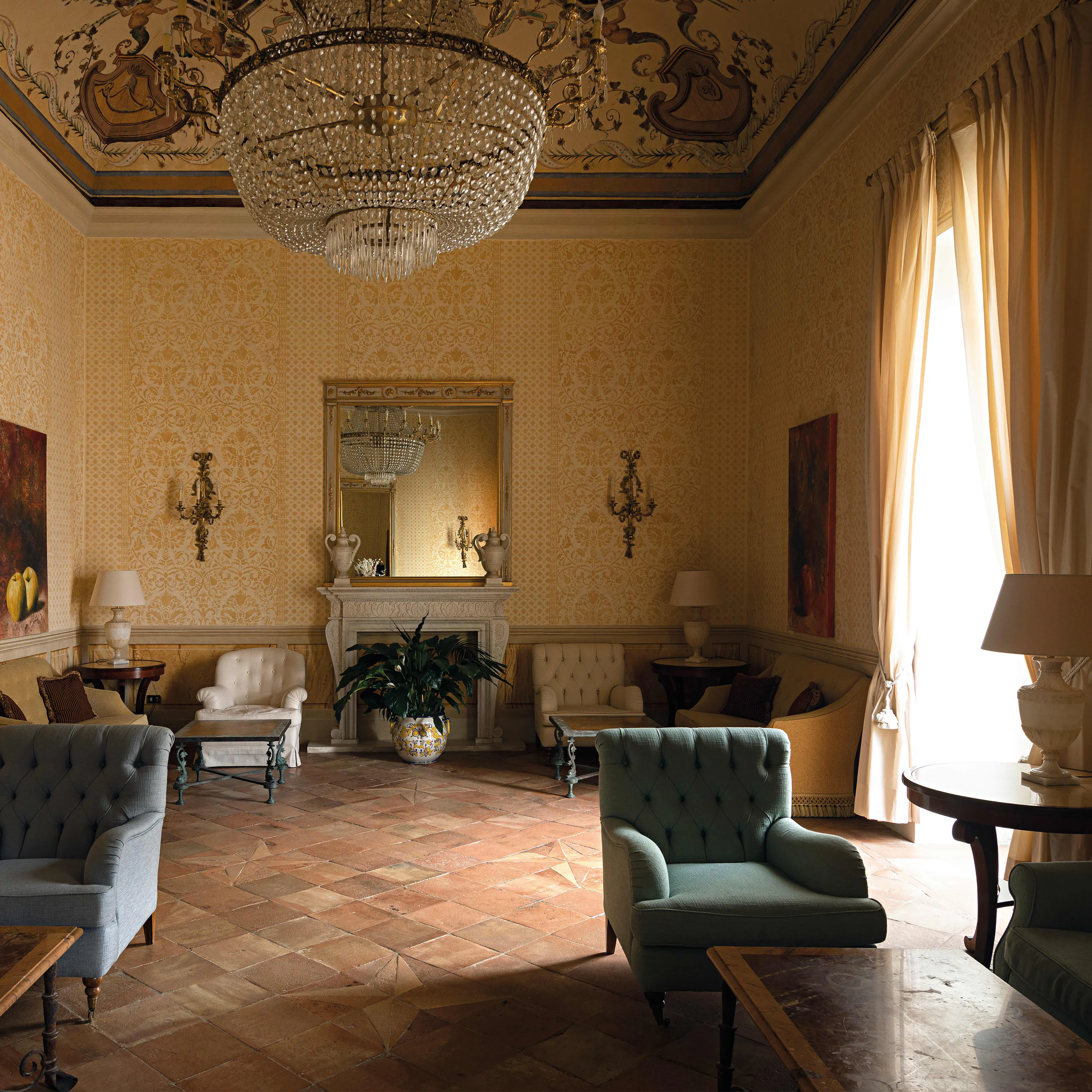 A tiled salon with a fireplace in a villa on the Amalfi Coast
