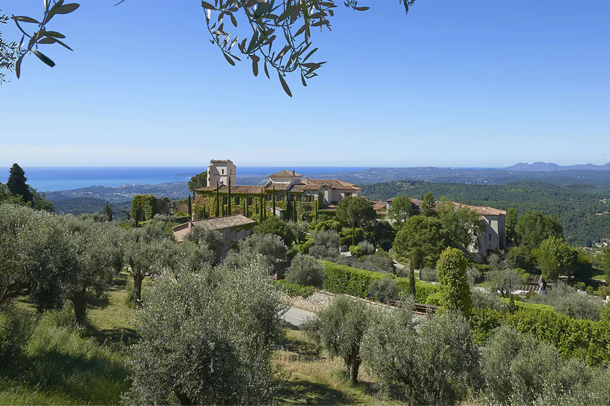 Hilltop château with olive trees and infinity pool overlooking the Mediterranean