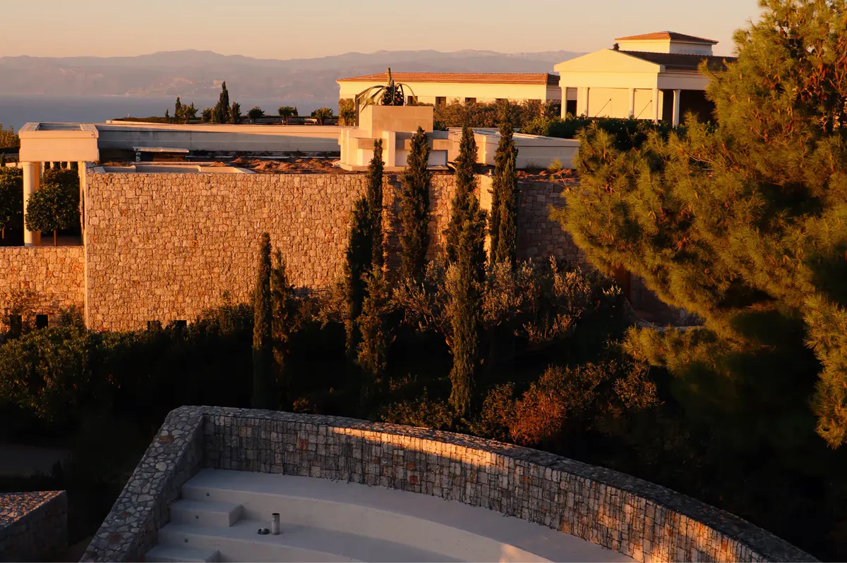 Waterfront pavilion at golden hour with Aegean seascape