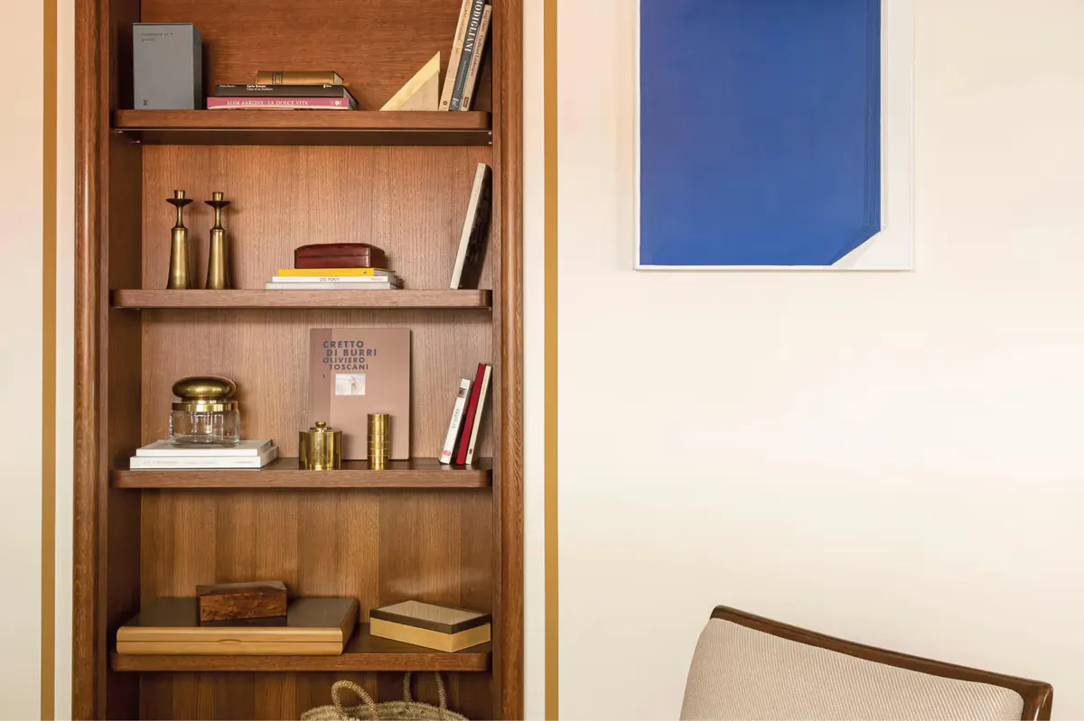 Built-in wooden shelving with books and decorative items