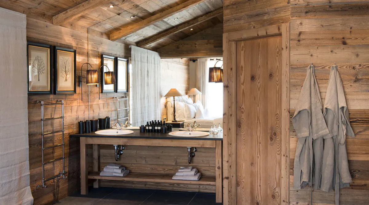 Wooden bathroom with a floating sink vanity and natural light