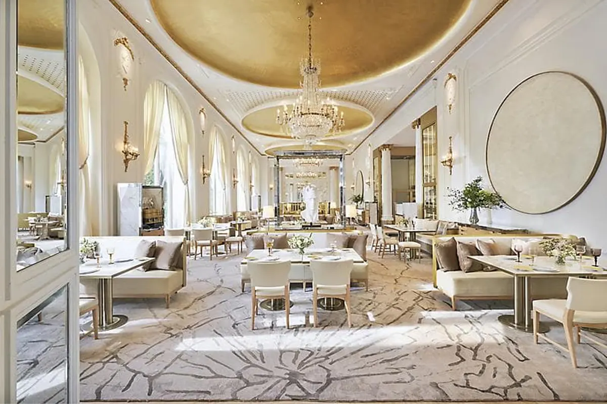 Grand Belle Époque dining room with gilt ceiling and crystal chandeliers