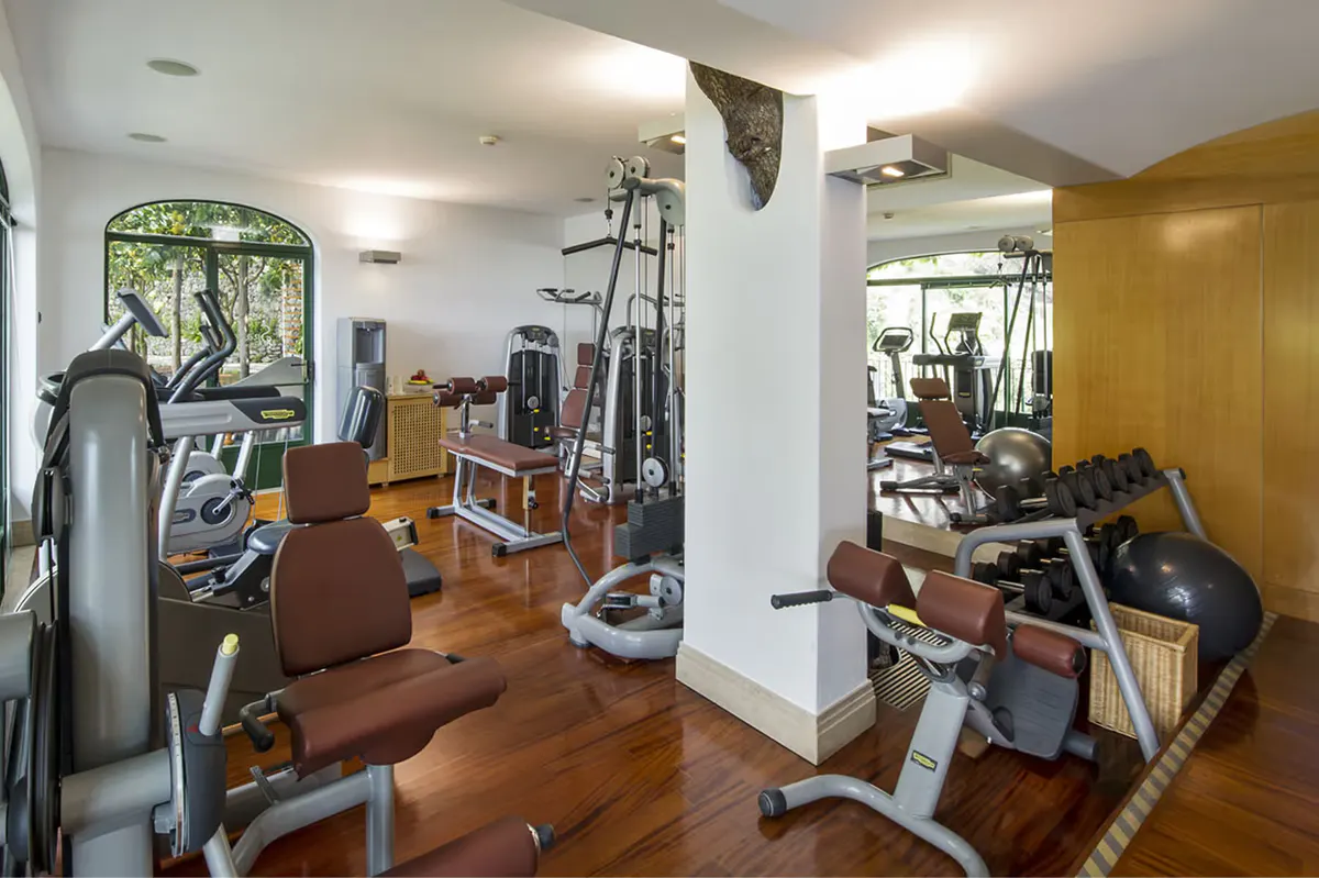 Fitness center with treadmills, functional equipment, and bright interior spaces