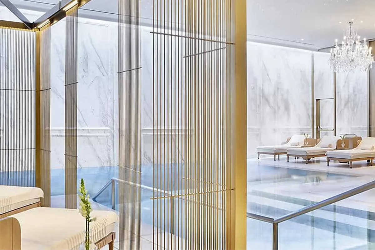 Spa treatment area with gold-leaf accents and lounge seating