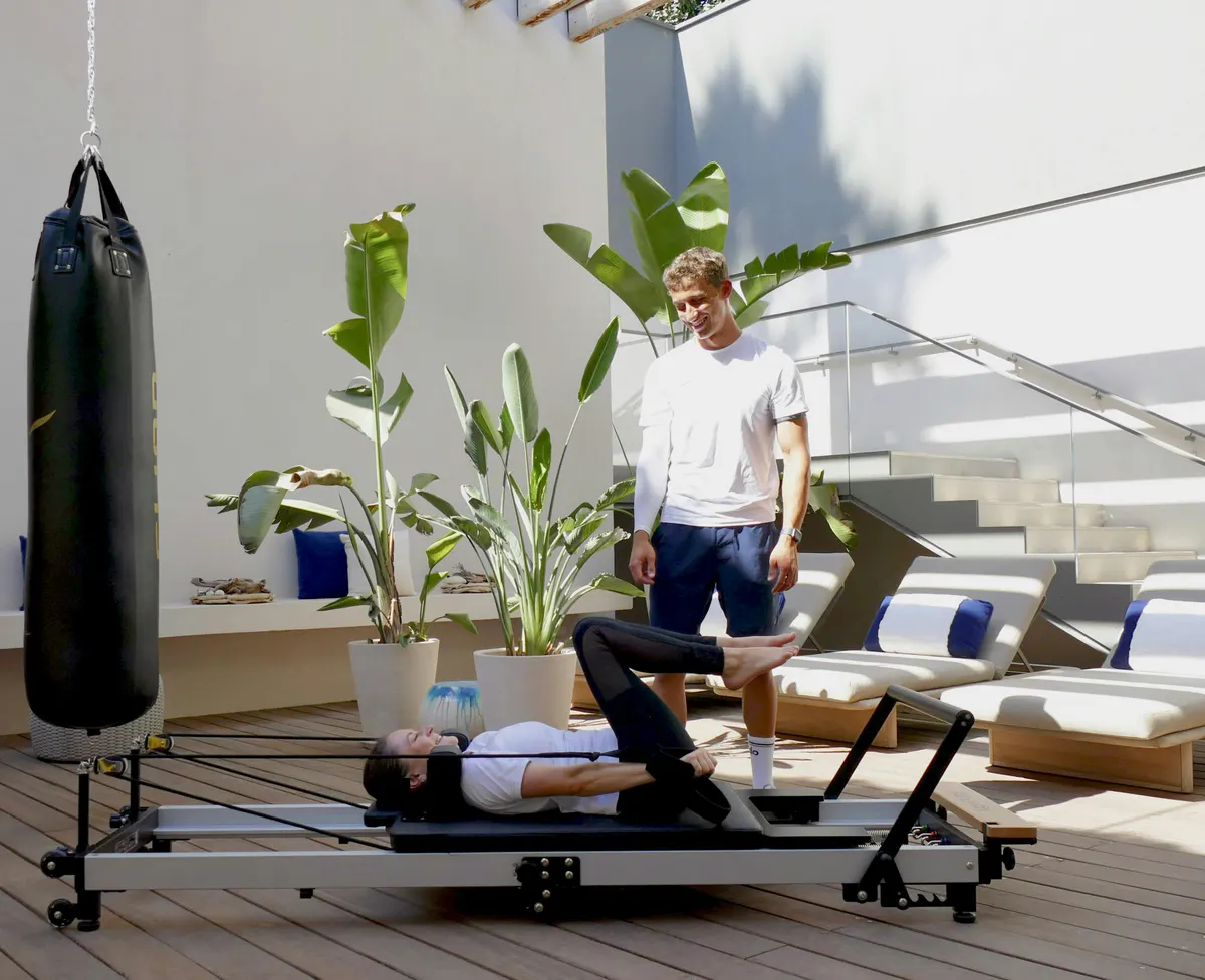 Yoga studio with punching bag and person in fitness attire