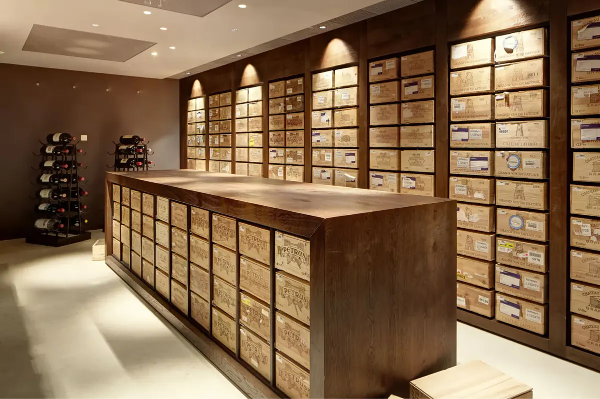 Wine cellar with glass storage walls and wooden display counter