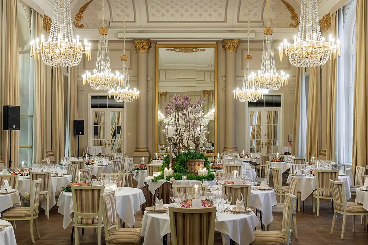 Grand ballroom with crystal chandeliers and neoclassical details