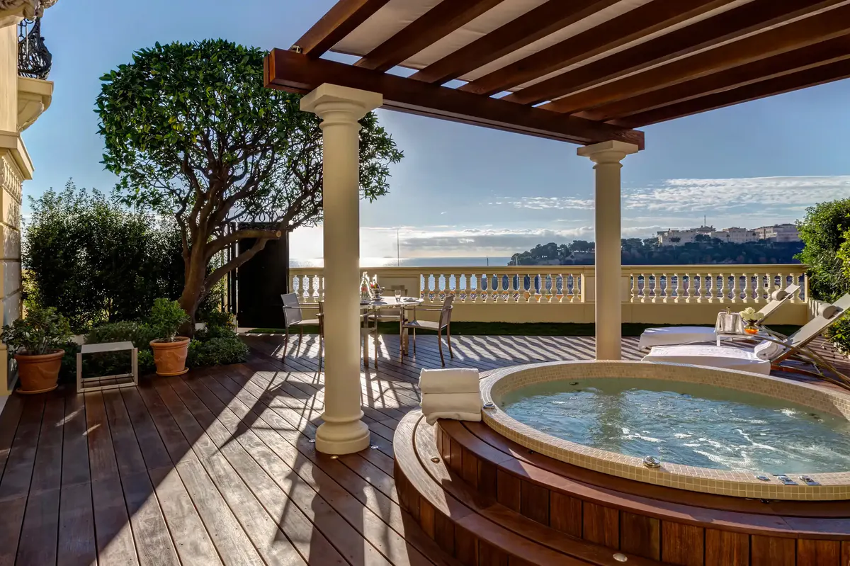 Rooftop terrace lounge with soaking tub, sea views and olive trees