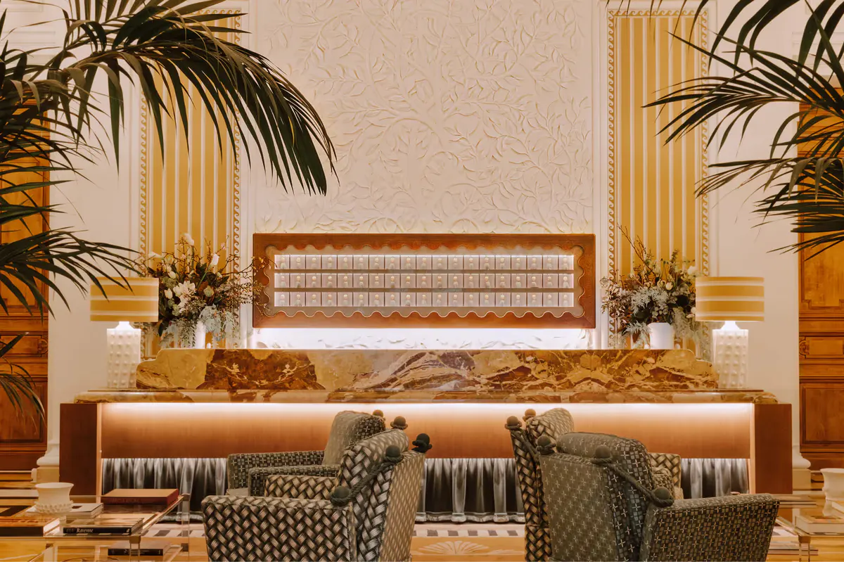 Reception seating with modern upholstered furniture and tropical plant arrangement