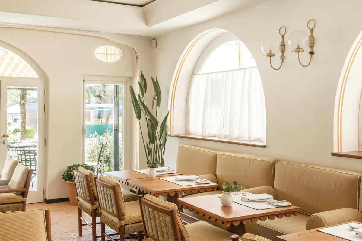 Restaurant interior with arch windows and tables