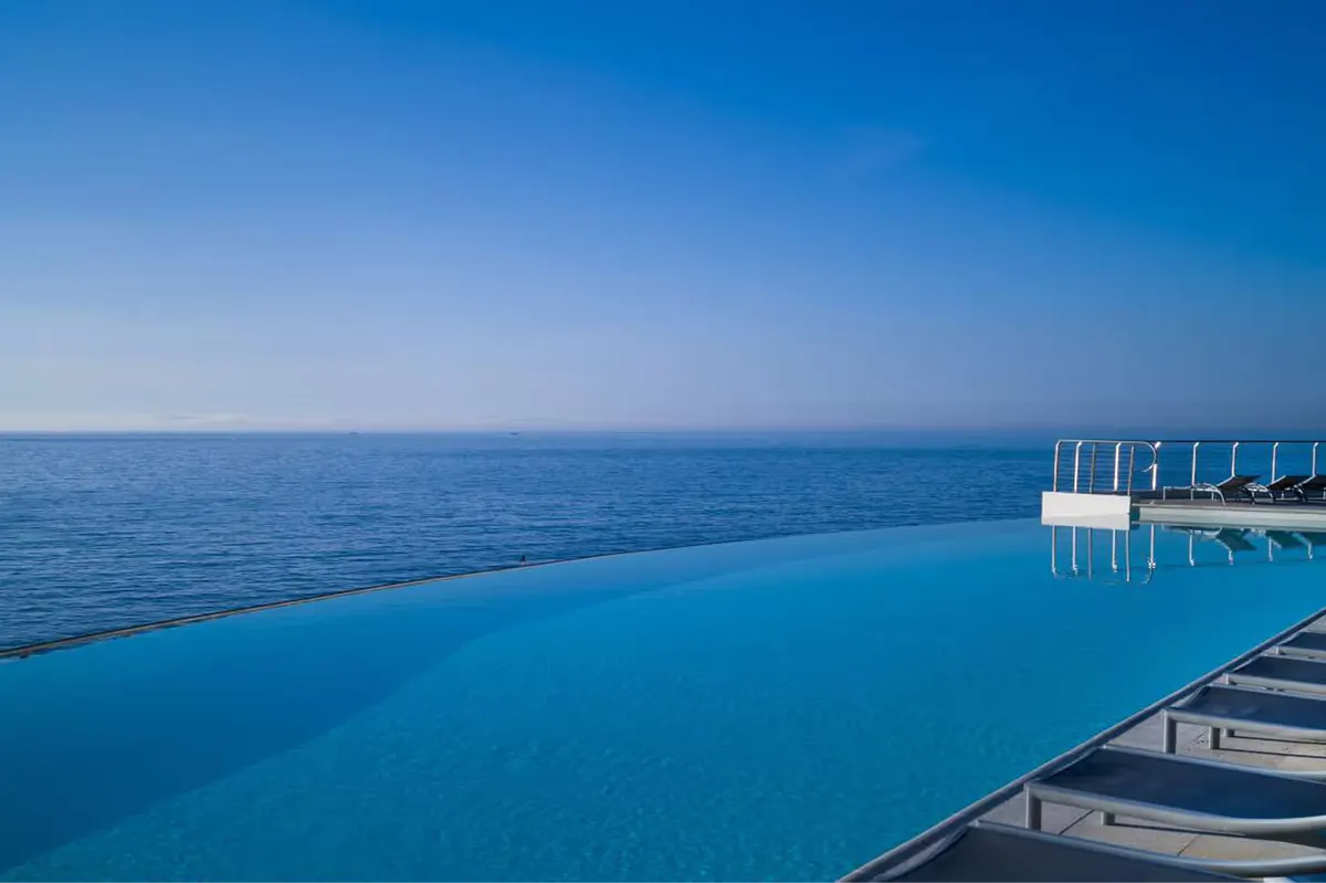 An infinity pool edges seamlessly into the sparkling Mediterranean Sea