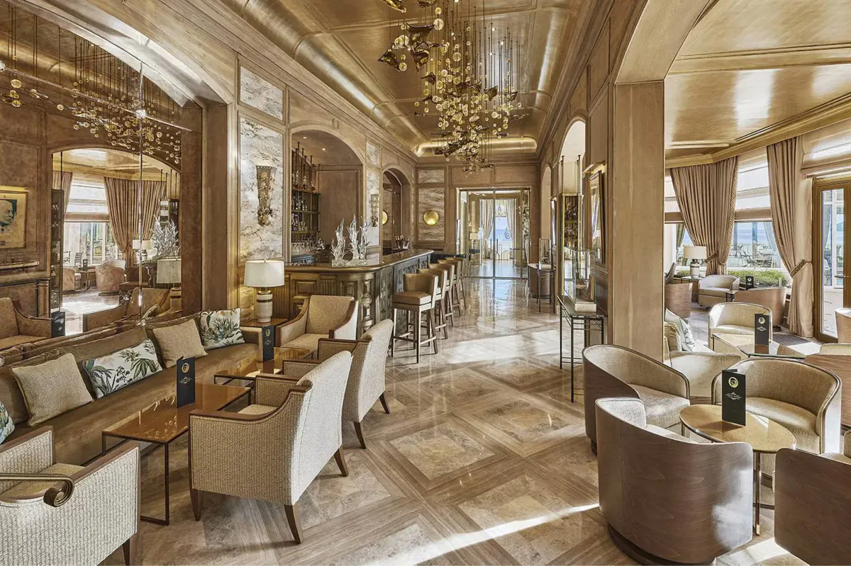 Grand salon with coffered ceiling and multiple seating arrangements