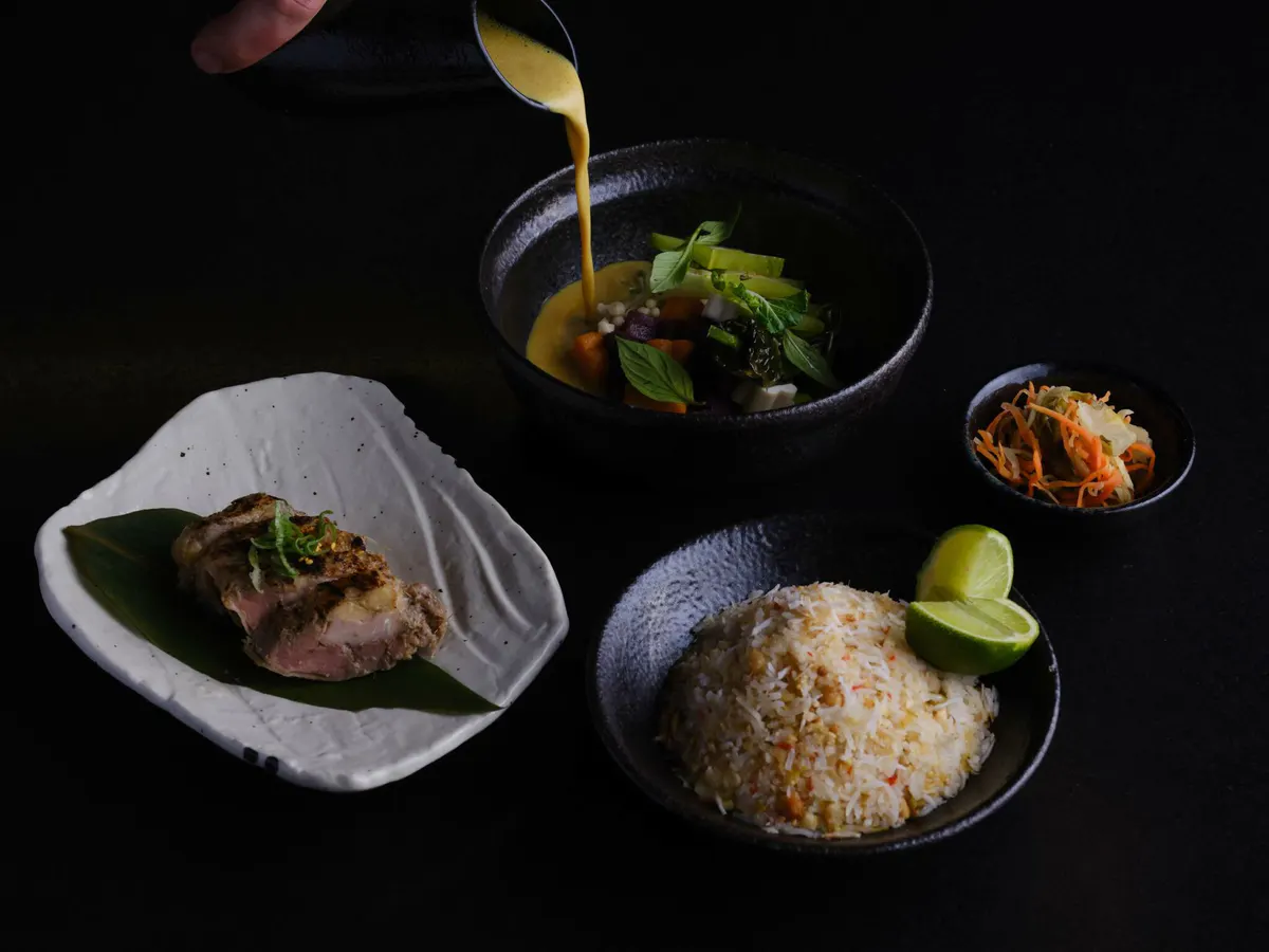 Artfully presented four-course tasting dishes with seafood, rice, and vegetable components