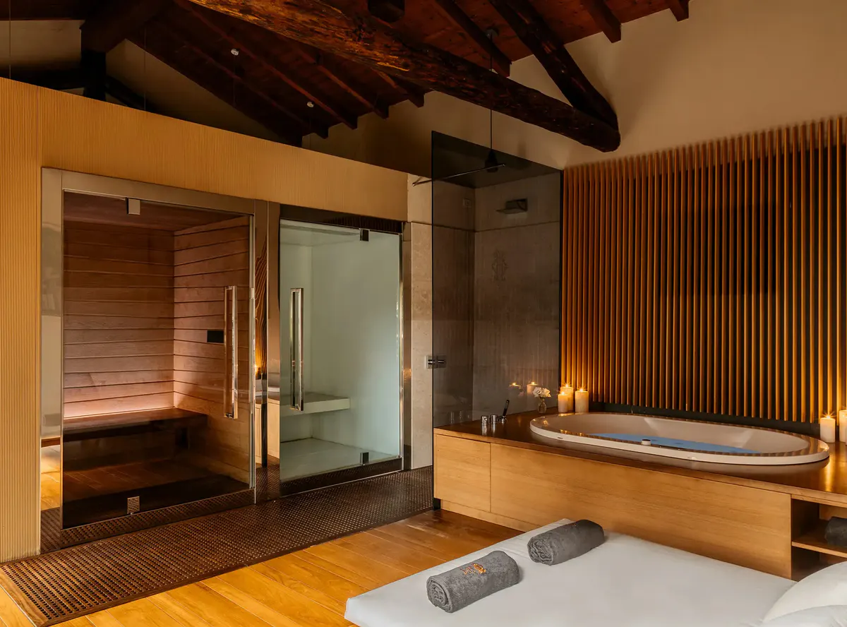 Spa area with sauna entrance, wood finishes, and stone accents
