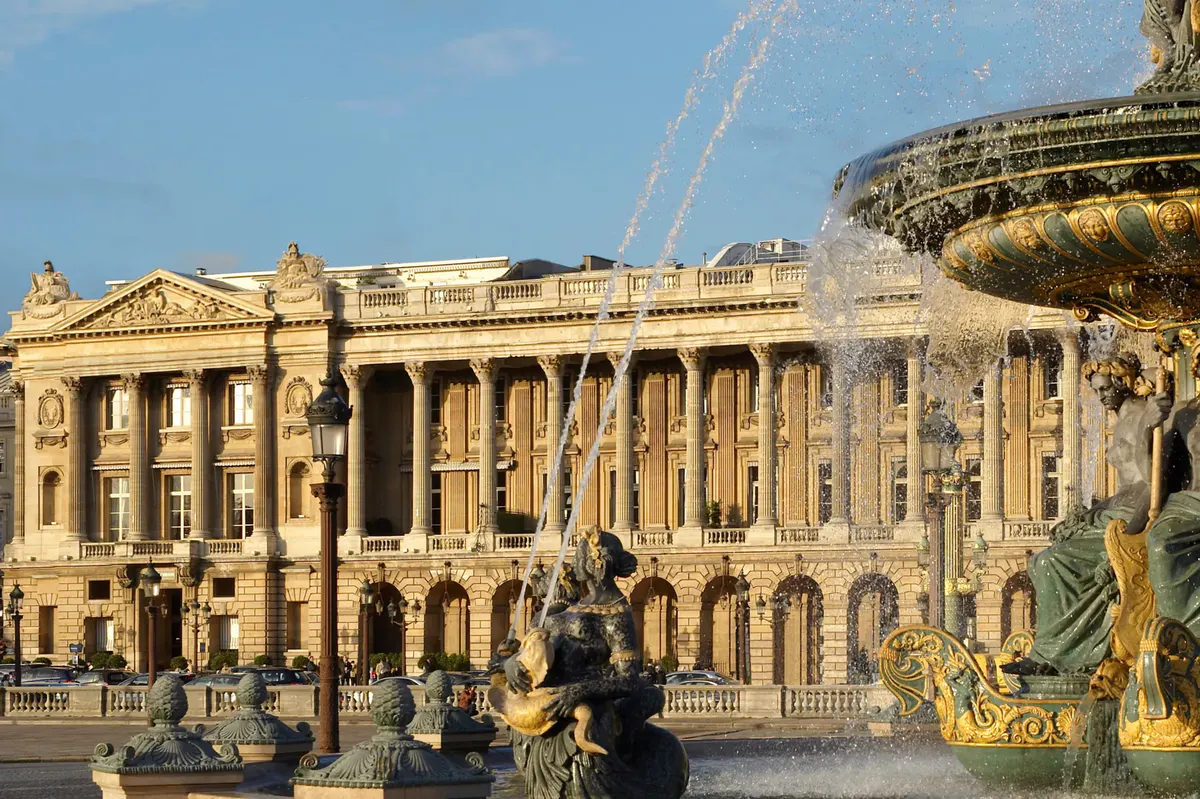 Classical building exterior with columns and sculptural detail at Place de la Concorde