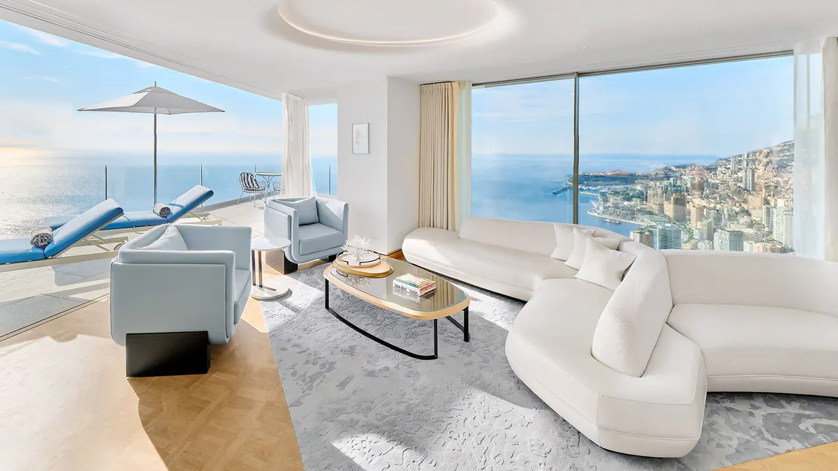 Lounge area with curved sofa and ocean vistas