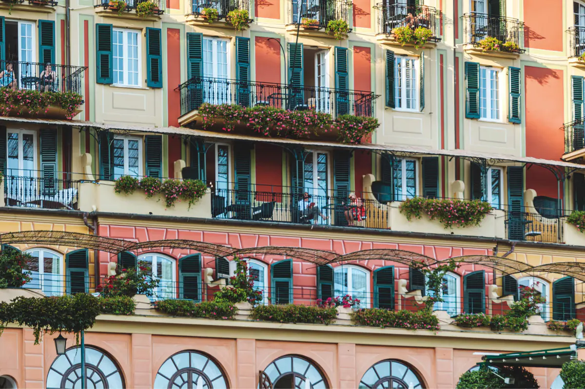 Colorful traditional buildings with shutters reflecting the coastal village architecture