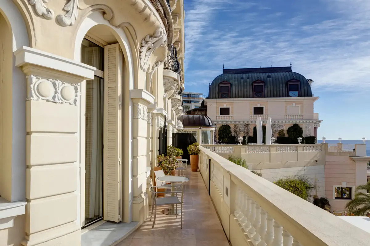 Rooftop terrace with soaking tub, lounge seating, sea views and arched stone archways