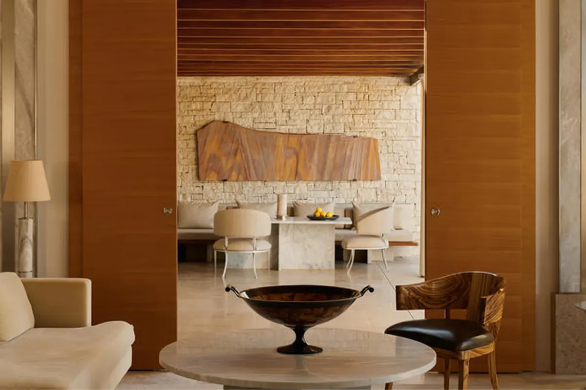 Residential interior with terracotta walls and windows overlooking countryside