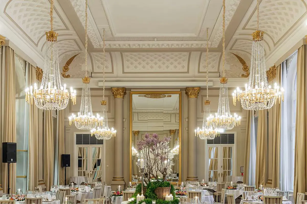 Grand ballroom with crystal chandeliers and neoclassical details