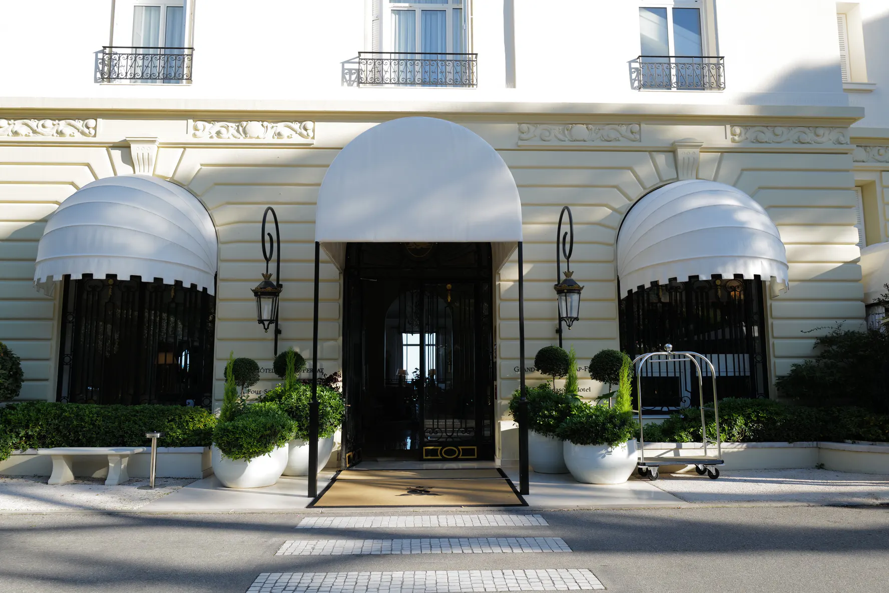 The white entrance and awning of the Grand-Hôtel du Cap-Ferrat